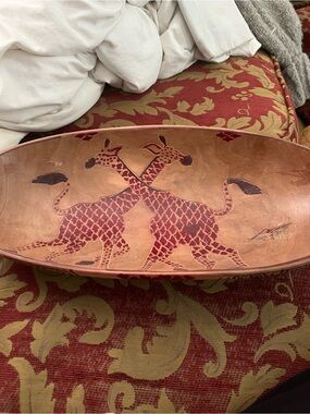 Giraffes carved in oblong bowl